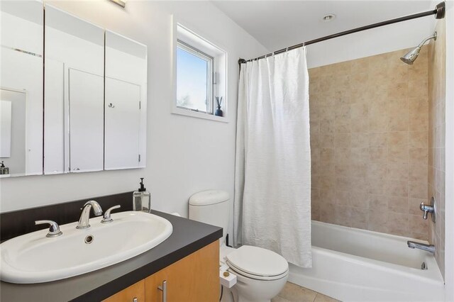 full bathroom featuring shower / bath combination with curtain, vanity, toilet, and tile patterned floors