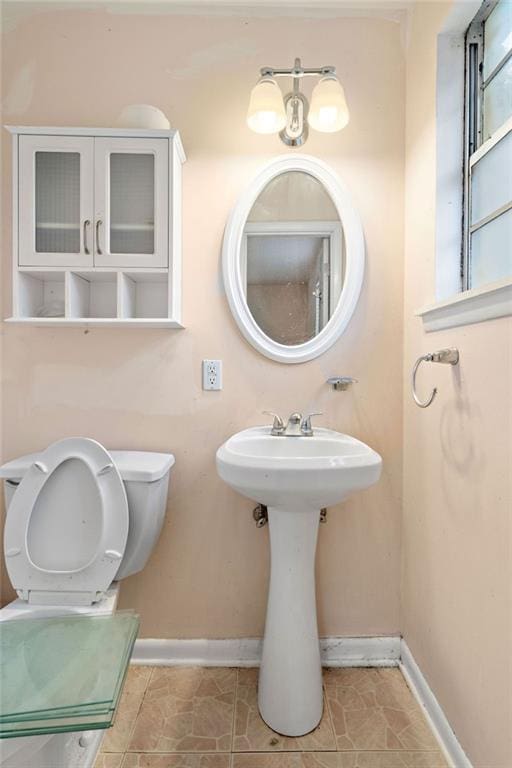 bathroom with tile patterned floors and toilet