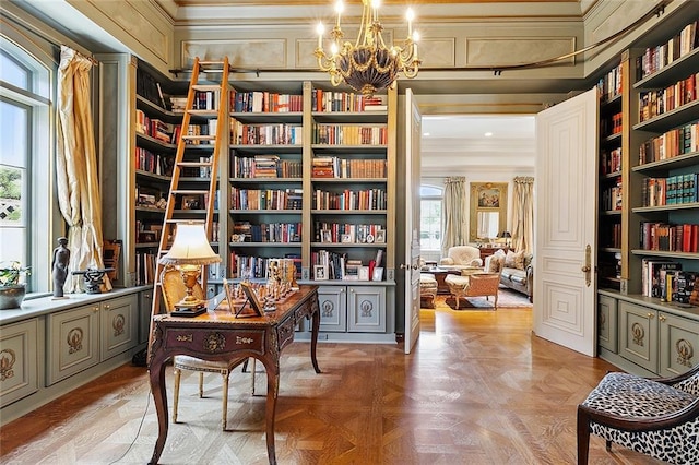 3832 Edenborn Ave, Metairie, LA 70002 - sitting room with wall of books, a chandelier, ornamental molding, a decorative wall, and built in shelves