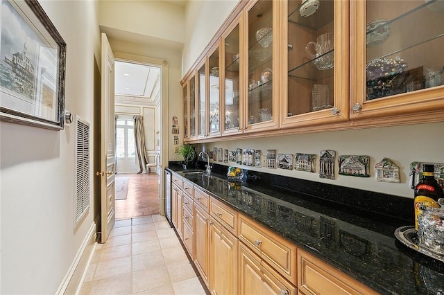 3832 Edenborn Ave, Metairie, LA 70002 - bar area with light tile patterned flooring, a sink, and baseboards