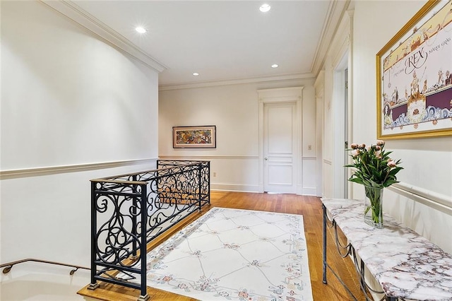 3832 Edenborn Ave, Metairie, LA 70002 - hall featuring wood finished floors, ornamental molding, and recessed lighting
