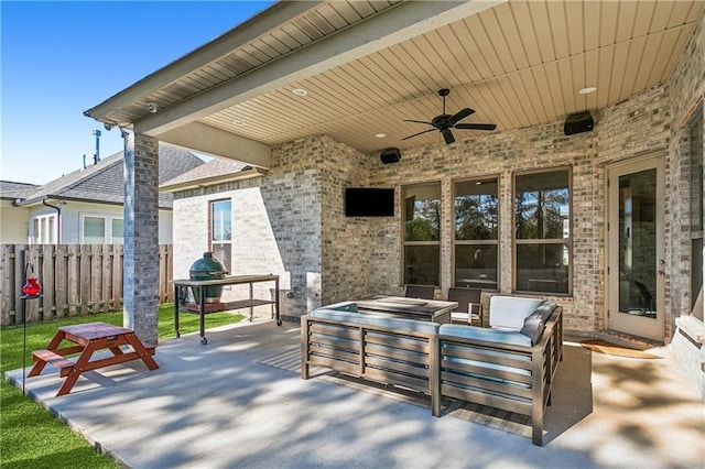 view of patio with an outdoor living space, ceiling fan, and a grill