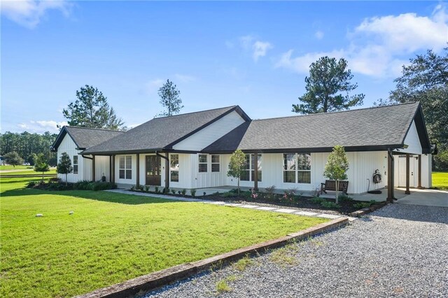 view of front of house with a garage and a front lawn