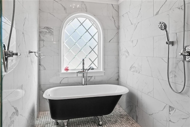 bathroom featuring a bathing tub and tile walls