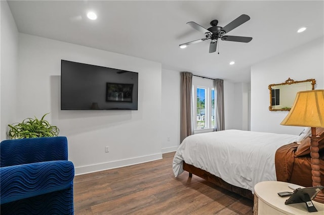 bedroom with ceiling fan and dark hardwood / wood-style flooring