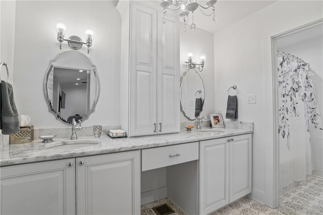 bathroom with walk in shower and vanity