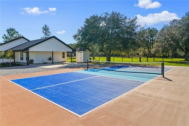 view of sport court featuring a shed