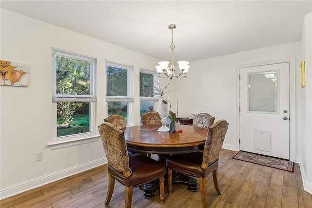 719 Lionel Ct, Abita Springs, LA 70420 - dining room with a chandelier and hardwood / wood-style flooring