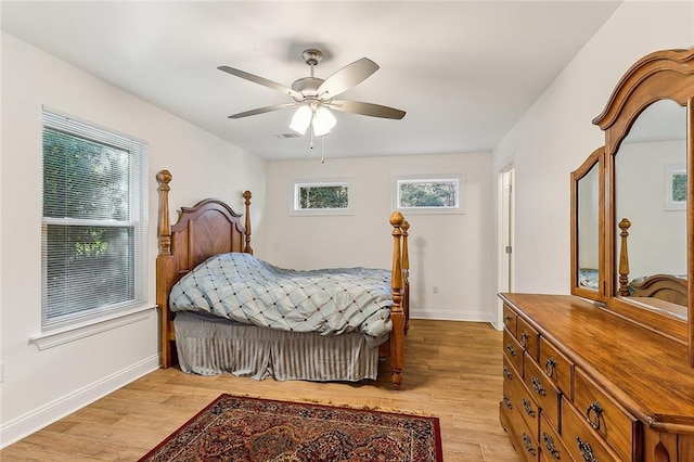 bedroom with ceiling fan and light wood-type flooring