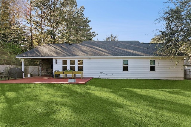 rear view of house featuring a patio area and a yard