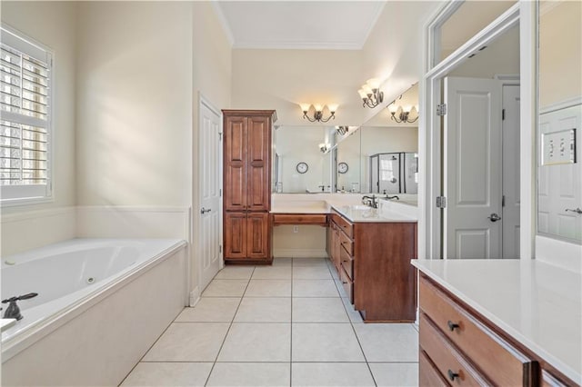 bathroom featuring vanity, a tub to relax in, tile patterned floors, and crown molding