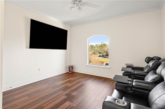 living room featuring dark hardwood / wood-style floors, ceiling fan, and crown molding