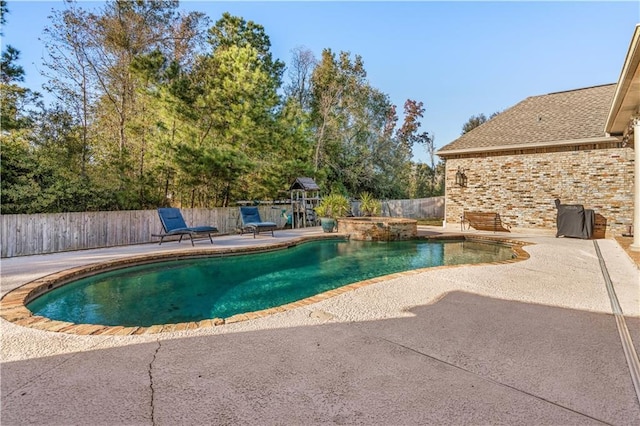 view of swimming pool featuring a patio area