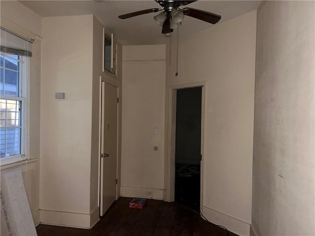 corridor with dark hardwood / wood-style floors