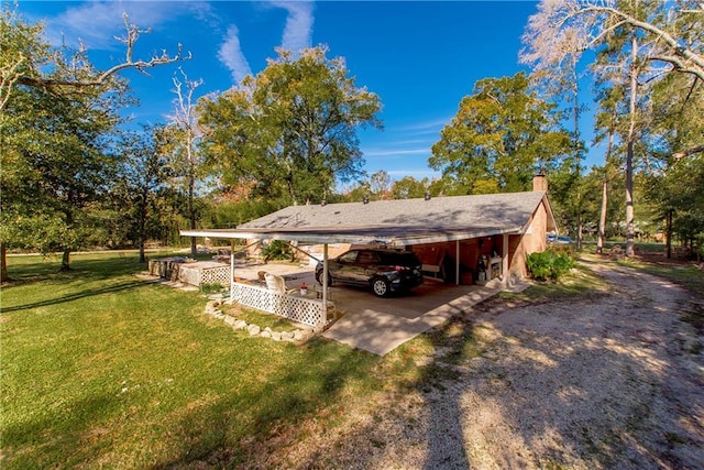 exterior space featuring a carport and a front lawn