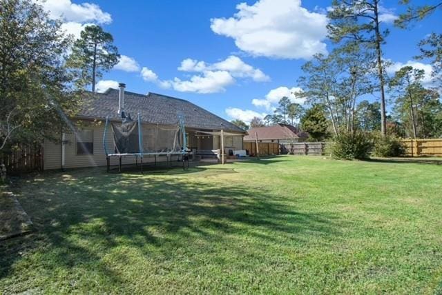 view of yard with a trampoline