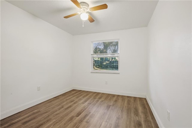1492 W Hall Ave, Slidell, LA 70460 - unfurnished room featuring wood finished floors, baseboards, and a ceiling fan