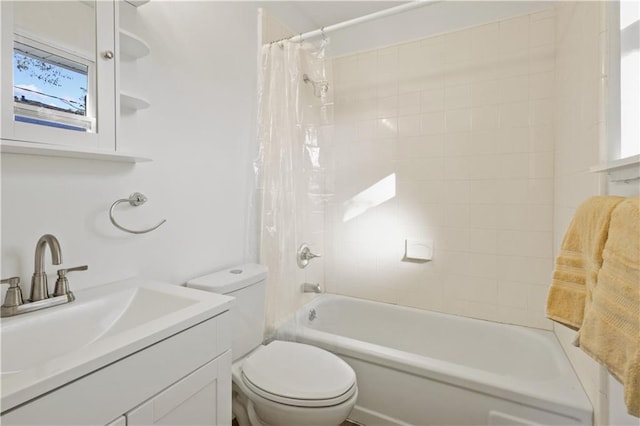 full bathroom with vanity, shower / bath combination with curtain, and toilet