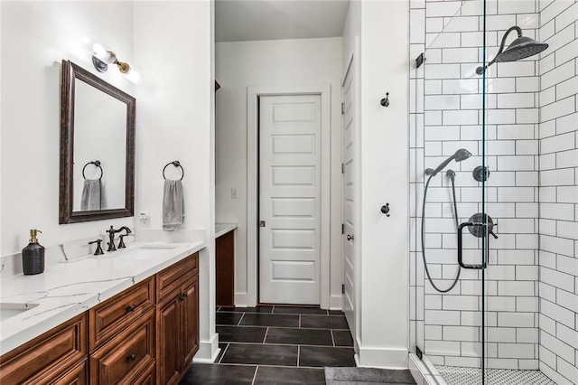 bathroom featuring vanity, tile patterned floors, and a shower with door