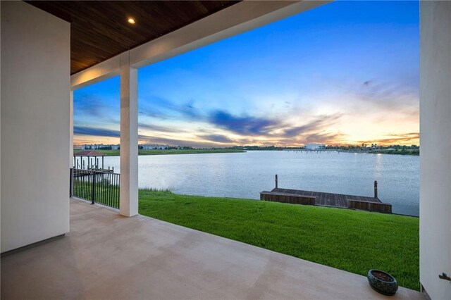 exterior space featuring a water view and a yard