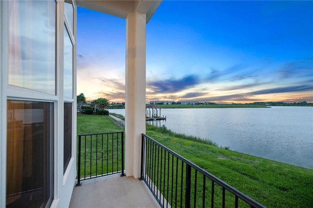 balcony at dusk with a water view