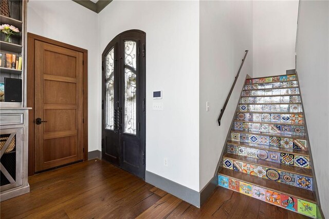 foyer with dark wood-type flooring