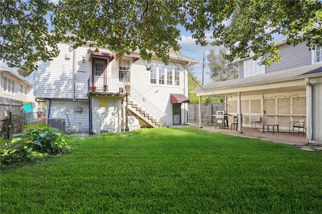 back of house with a yard