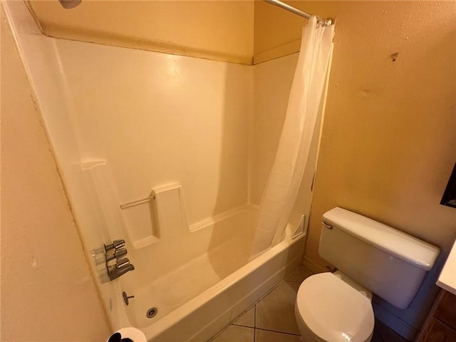 bathroom featuring tile patterned floors and toilet