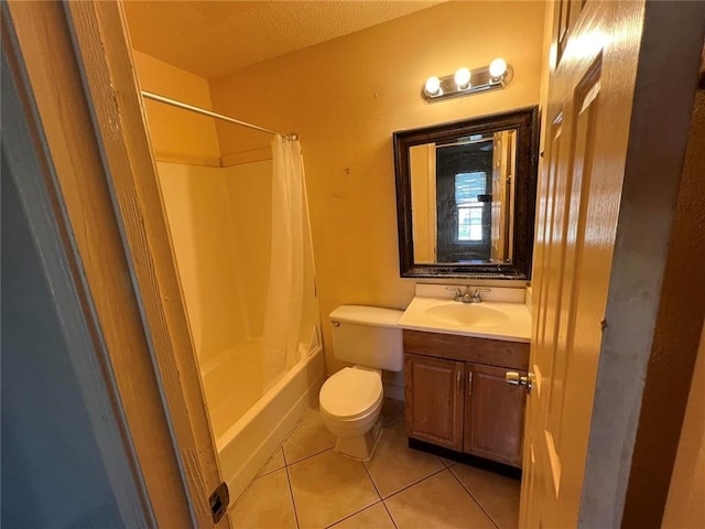 full bathroom with tile patterned floors, a textured ceiling, toilet, shower / tub combo with curtain, and vanity