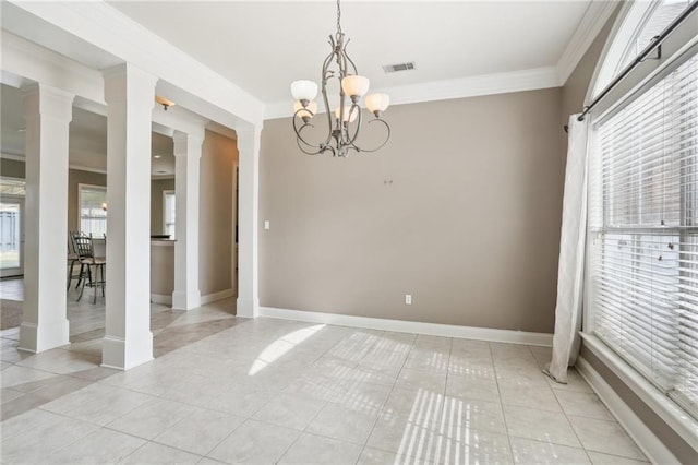 tiled spare room with decorative columns, ornamental molding, and a notable chandelier