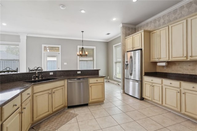 kitchen with sink, hanging light fixtures, stainless steel appliances, an inviting chandelier, and ornamental molding