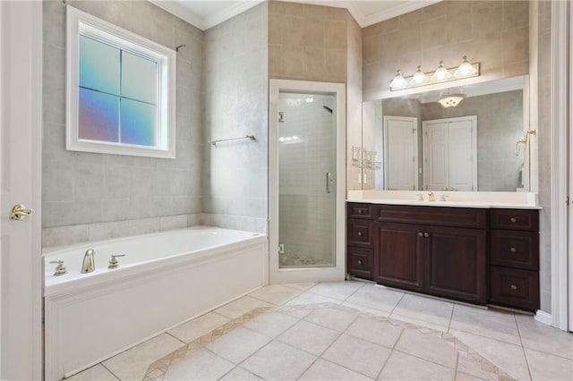 bathroom featuring vanity, tile patterned floors, crown molding, shower with separate bathtub, and tile walls