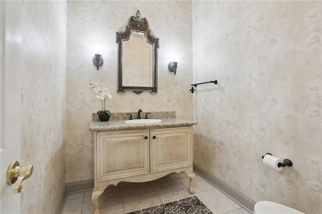 bathroom featuring tile patterned flooring and vanity