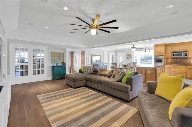 living room with hardwood / wood-style floors and a textured ceiling