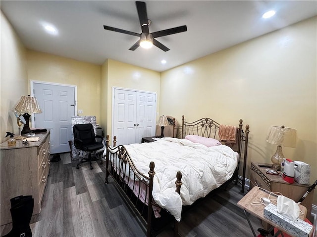 bedroom featuring dark hardwood / wood-style flooring, a closet, and ceiling fan