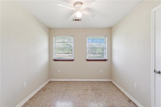 spare room with ceiling fan