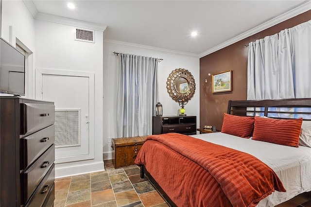 bedroom with crown molding