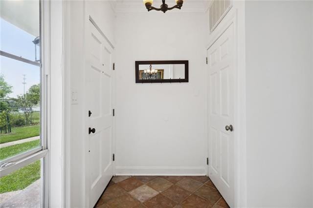 entryway with a notable chandelier