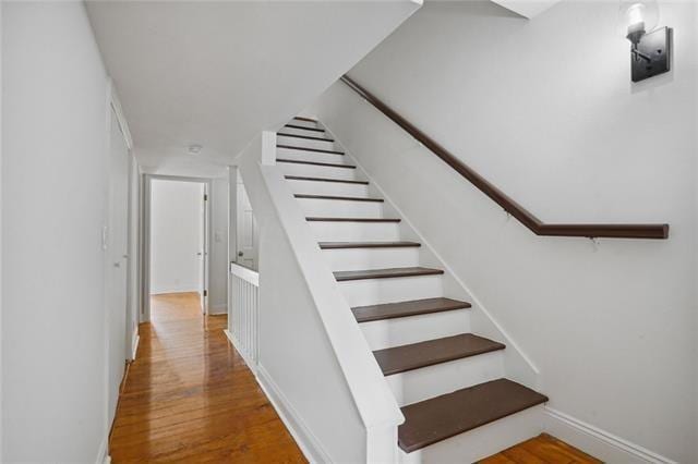 staircase featuring hardwood / wood-style floors