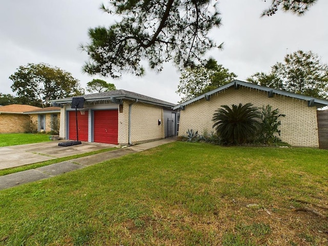 view of front facade with a front yard and a garage