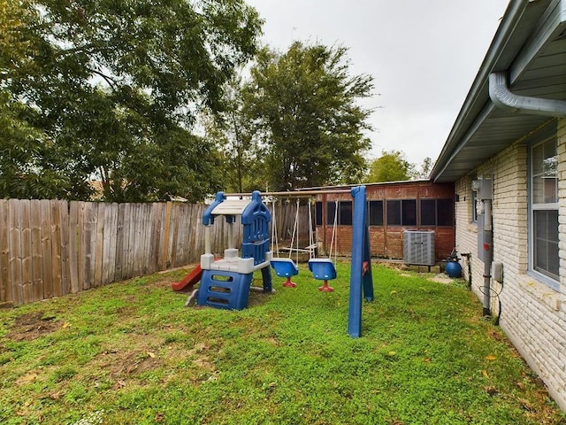 view of yard featuring central air condition unit