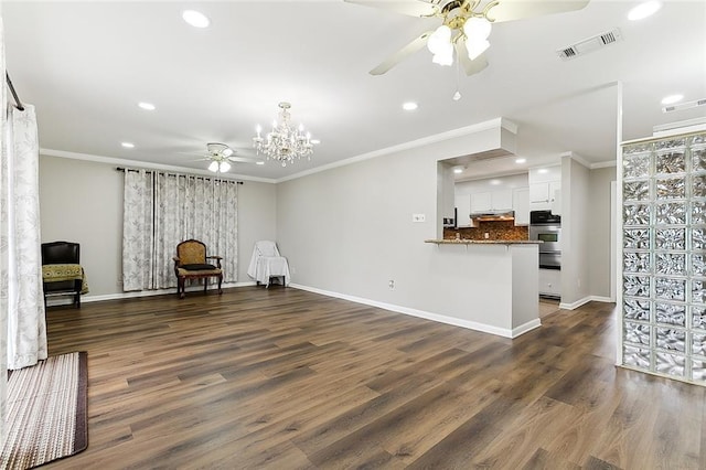 interior space with ceiling fan with notable chandelier, crown molding, and dark wood-type flooring