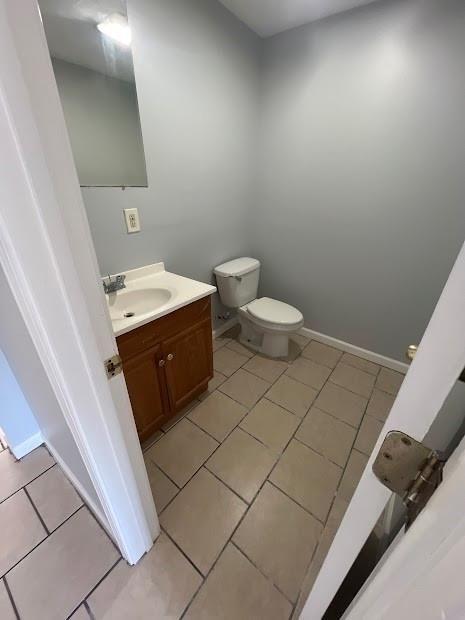 1300 Bolo Ct, Bridge City, LA 70094 - bathroom featuring tile patterned flooring, vanity, and toilet