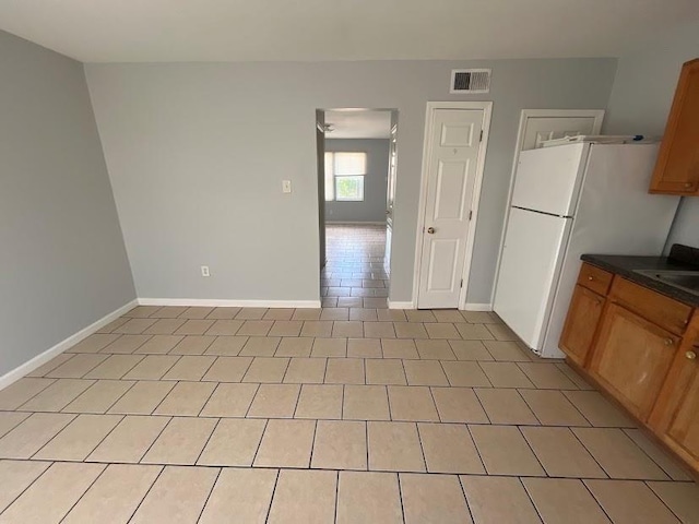 1300 Bolo Ct, Bridge City, LA 70094 - kitchen with light tile patterned flooring and white fridge