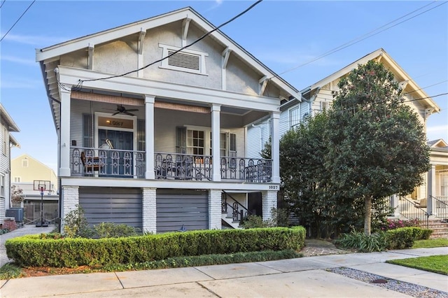 view of front of house with ceiling fan, a porch, and central air condition unit