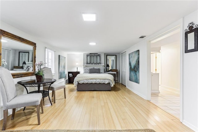 bedroom with hardwood / wood-style floors