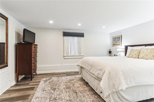 bedroom with dark wood-type flooring