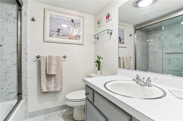 full bathroom with vanity, toilet, and bath / shower combo with glass door