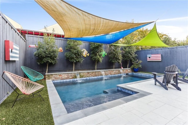 view of swimming pool with a patio area and pool water feature