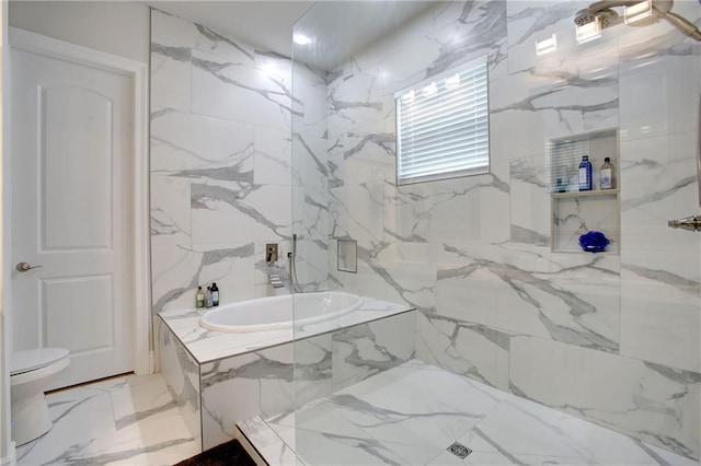 bathroom with tile walls and tiled tub